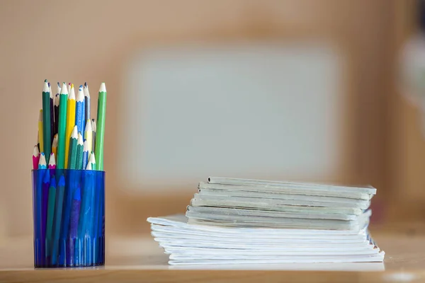 Wooden colorful drawing pencils arranged in plastic jug and stac — Stock Image Wooden colorful drawing pencils arranged in plastic jug and stac Stock Picture