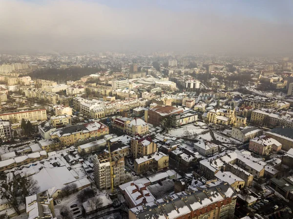 Aerial black and white winter top view of modern city center wit — Stock Photo, Image