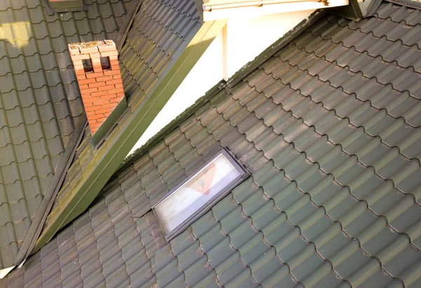 Close-up of new attic plastic window installed in shingled house — Stock Photo, Image
