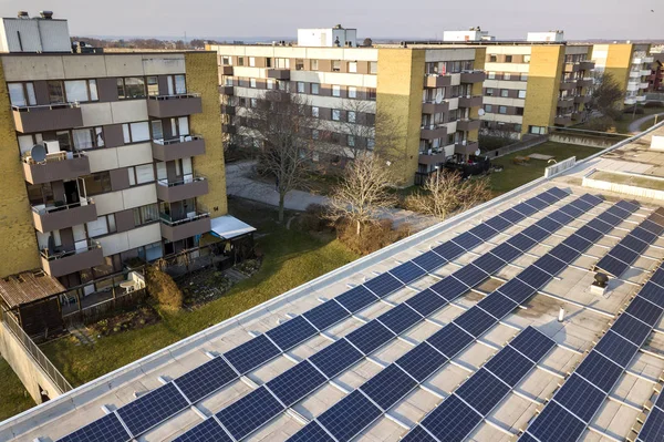 Aerial view of blue shiny solar photo voltaic panels system on c