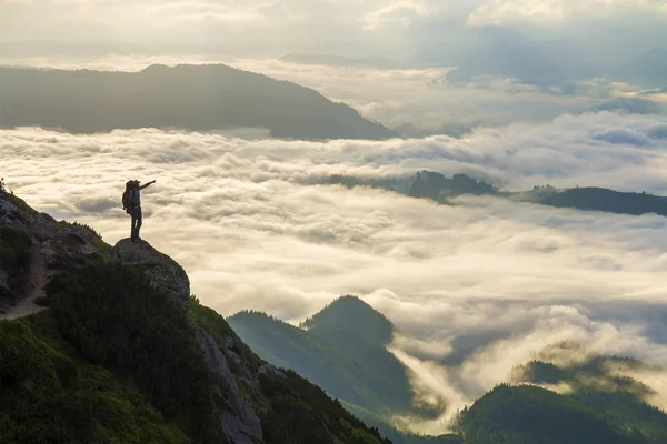 Wide mountain panorama. Small silhouette of tourist with backpac — Stock Photo, Image