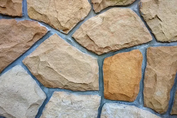 Piasek kamienny ściana do wykorzystania jako tło. — Zdjęcie stockowe