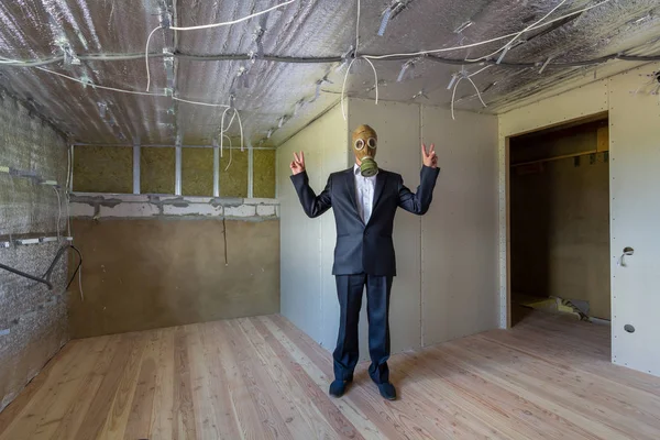 Strange man in businessman suit and gas protection mask inside a