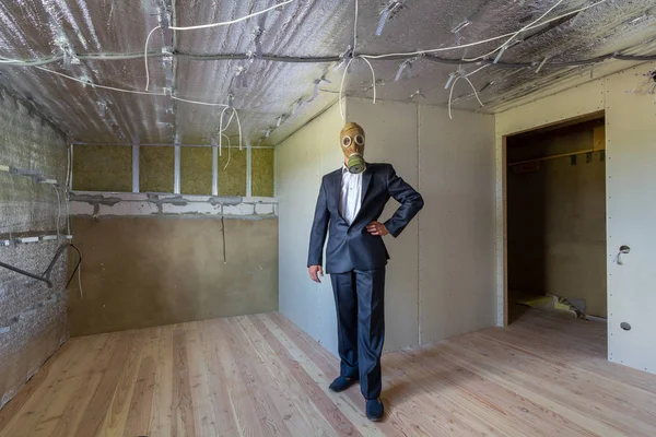 Strange man in businessman suit and gas protection mask inside a