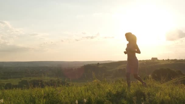 Young Woman Pink Dress Running Summer Meadow Warm Sunset — Stock Video