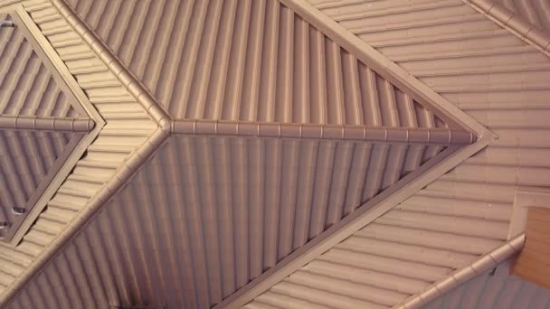 Aerial view of house roof structure covered with brown metal tile sheets. — Stock Footage Aerial View House Roof Structure Covered Brown Metal Tile Sheets Stock Footage