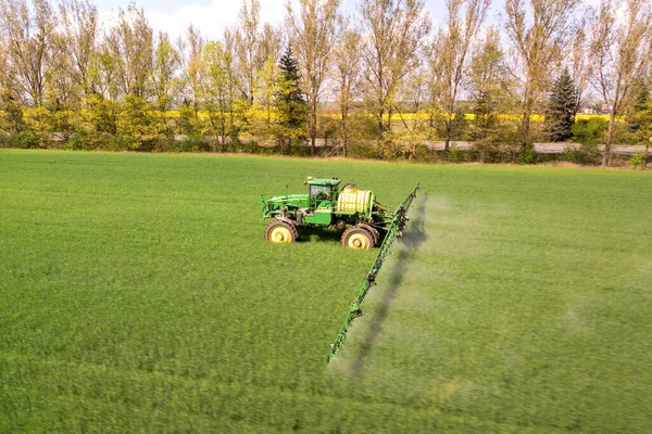Tractor Spraying Chemical Pesticides Sprayer Large Green Agricultural Field Spring — Stock Photo, Image