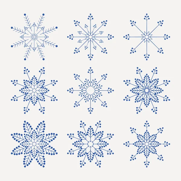 Christmas set of beautiful fragile snowflakes of blue color, — Stock Vector