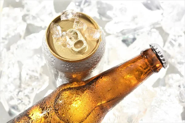 beer can and bottle chilled in ice