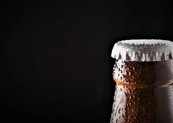 beer bottle cap closeup isolated black background