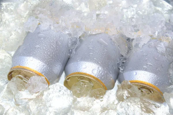 beer can chilled in ice in cooler bucket