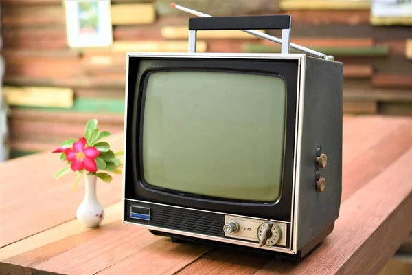 vintage television set on wood table