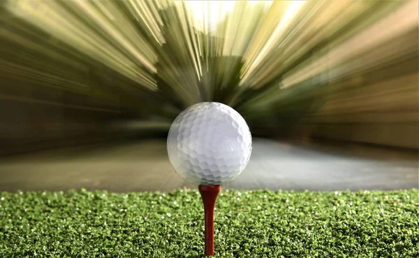 golf ball on red tee  on moving background