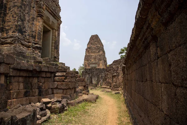 Landscape with ancient temple in Angkor Wat complex, Cambodia. Pre Rup temple internal yard and stone wall. Khmer architecture legacy. Tourist place of interest. Tourism travel and sightseeing in Asia