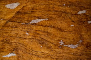 Sıcak kahverengi ahşap doku closeup, ahşap fotoğraf arka plan. Doğal ahşap zemin. Sıkıntılı yıpranmış kereste kurulu. Kahverengi ahşap yüzey. Ahşap masa üstü görünümü. Antika laquered ahşap