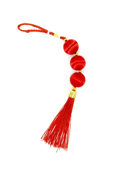 Curvy red knot with tassel, top view photo. Asian holiday symbol. Red silk knot isolated. Chinese New Year decoration. — Stock Photo, Image