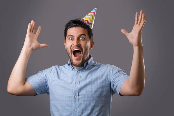 Handsome Shocked Young Brunet Guy Party Cap Screaming Raised Hands — Stock Photo, Image