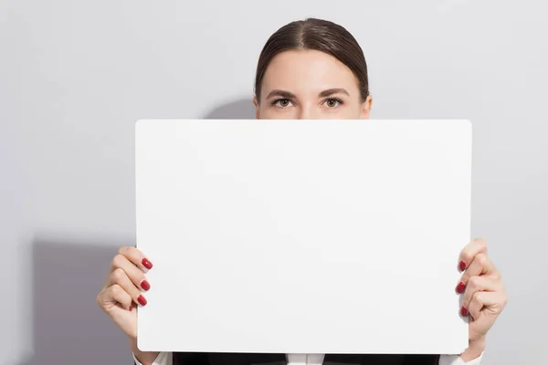 Young Smiling Business Woman Holding Empty Poster On Grey Background Fashion Style Photoshoot With Hard Light Source Success Office Stock Photo 198586182