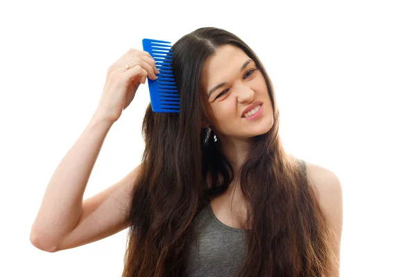 Young woman with problem hair. White background — Stock Photo, Image