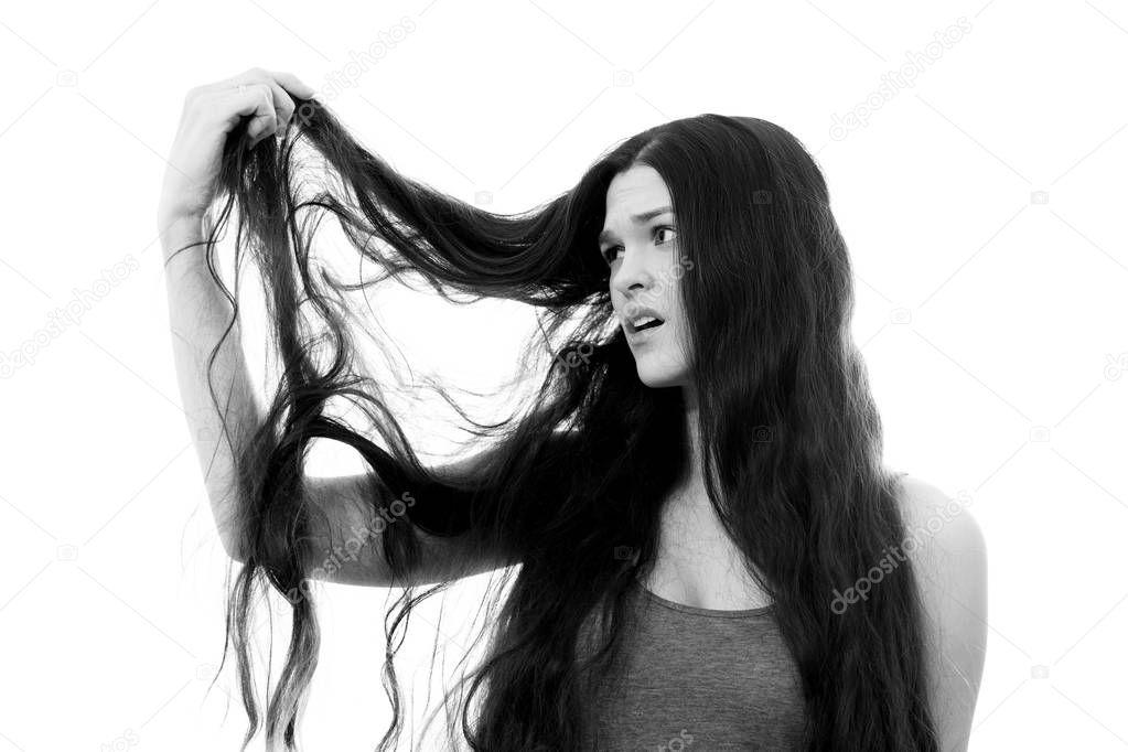 Young woman with problem hair. White background