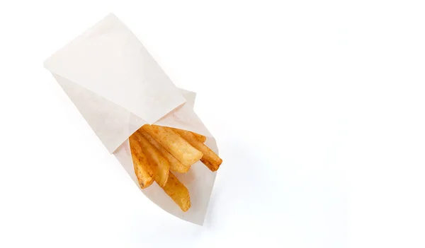 French Fries In A Brown Kraft Paper Bag Isolated On A White