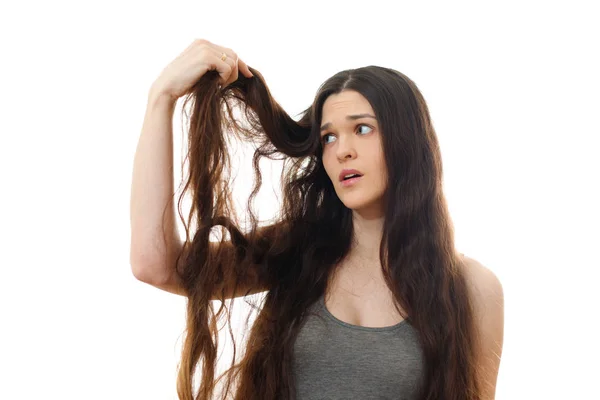 Jovem com cabelo problemático. Fundo branco — Fotografia de Stock