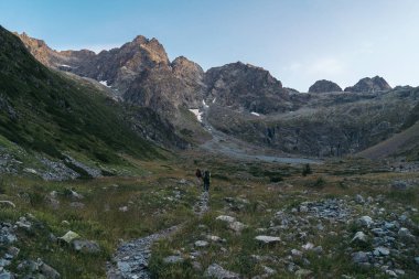 Hikers in the mountain, National Park of Ecrins, Alps, France clipart