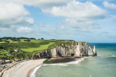 Etretat Aval cliff, rocks and natural arch landmark and blue ocean. Aerial view. Normandy, France, Europe clipart