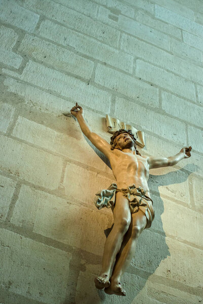 Statue of Jesus Christ crucified on wall