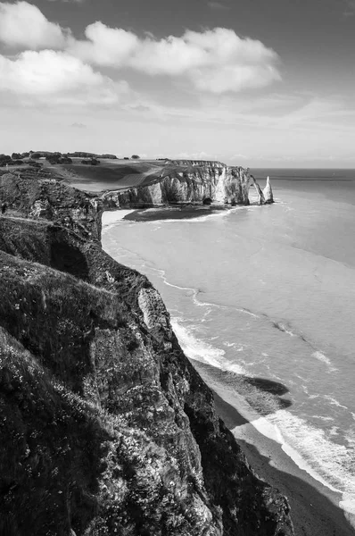 Etretat Aval cliff, rocks and natural arch landmark and blue ocean. Aerial view. Normandy, France, Europe