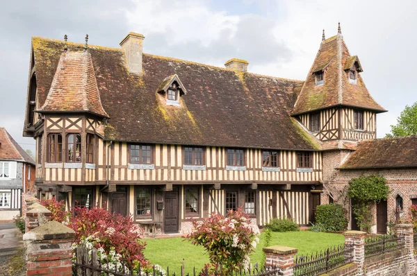 BEUVRON-EN-AUGE, FRANCE, APRIL 26, 2014: Typical timber frame buildings in the village center. Beuvron-en-Auge is one of the most beautiful villages in France