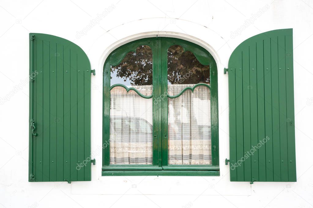 Green wooden window in La Flotte, Ile de Re, France