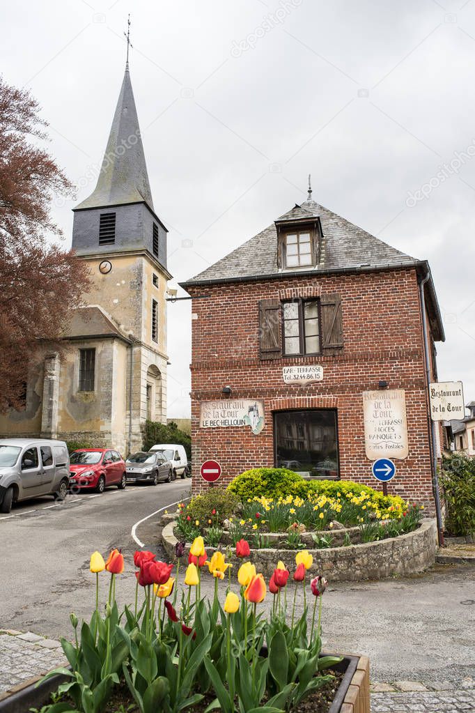 LE BEC-HELLOUIN, FRANCE - APRIL 23, 2016: Old house and church in the village center, Le Bec-Hellouin, Normandy, France