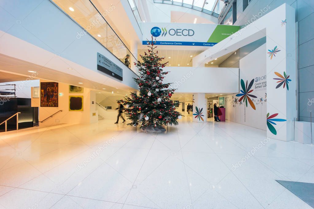 PARIS, FRANCE - DECEMBER 13, 2016: OECD(Organisation for Economic Co-operation and Development)interior with Christmas tree. The OECD is founded in 1961 to stimulate economic progress and world trade