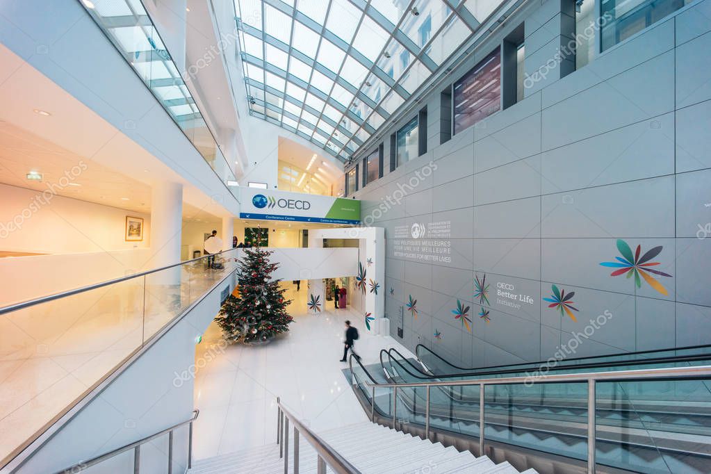 PARIS, FRANCE - DECEMBER 13, 2016: OECD(Organisation for Economic Co-operation and Development)interior with Christmas tree. The OECD is founded in 1961 to stimulate economic progress and world trade