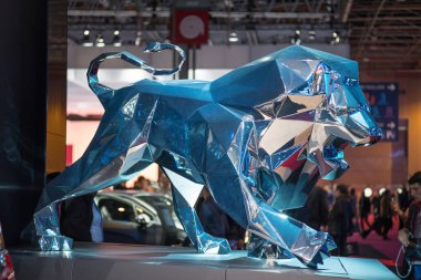 PARIS, FRANCE - OCTOBER 11, 2016: Peugeot 's symbol - a statue of lion, at Paris Motor Show clipart
