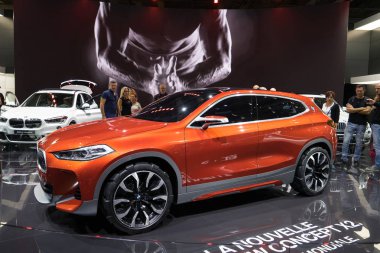PARIS, FRANCE - OCTOBER 5, 2016: BMW Concept X2 is displayed on Paris Motor Show. It's an even-numbered, low-roofed SUV bringing the slammed X6/X4 vibe to a smaller, more affordable package clipart