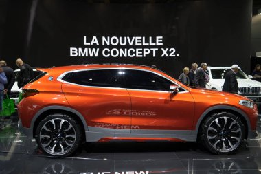 PARIS, FRANCE - OCTOBER 5, 2016: BMW Concept X2 is displayed on Paris Motor Show. It's an even-numbered, low-roofed SUV bringing the slammed X6/X4 vibe to a smaller, more affordable package clipart