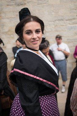 SAINTES-MARIES-DE-LA-MER, OCTOBER 19: Woman in traditional costume during the Pilgrimage of the Saintes on October 19, 2013 in Saintes-Maries-de-la-Mer, France. It is a famous pilgrimage in Camargue