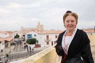 SAINTES-MARIES-DE-LA-MER, OCTOBER 19: Woman in traditional costume during the Pilgrimage of the Saintes on October 19, 2013 in Saintes-Maries-de-la-Mer, France. It is a famous pilgrimage in Camargue
