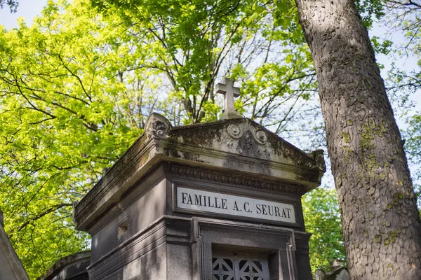 PARIS, FRANCE - MAY 2, 2016: Georges-Pierre Seurat's grave in the Pere Lachaise Cemetery. He was a French post-Impressionist painter and draftsman. He is noted for chromoluminarism and pointillism