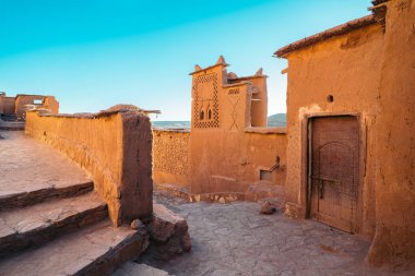 Village of Ait Ben Haddou at sunset. It is an ighrem (fortified village in English) (ksar in Arabic), along the former caravan route between the Sahara and Marrakech in present-day Morocco clipart
