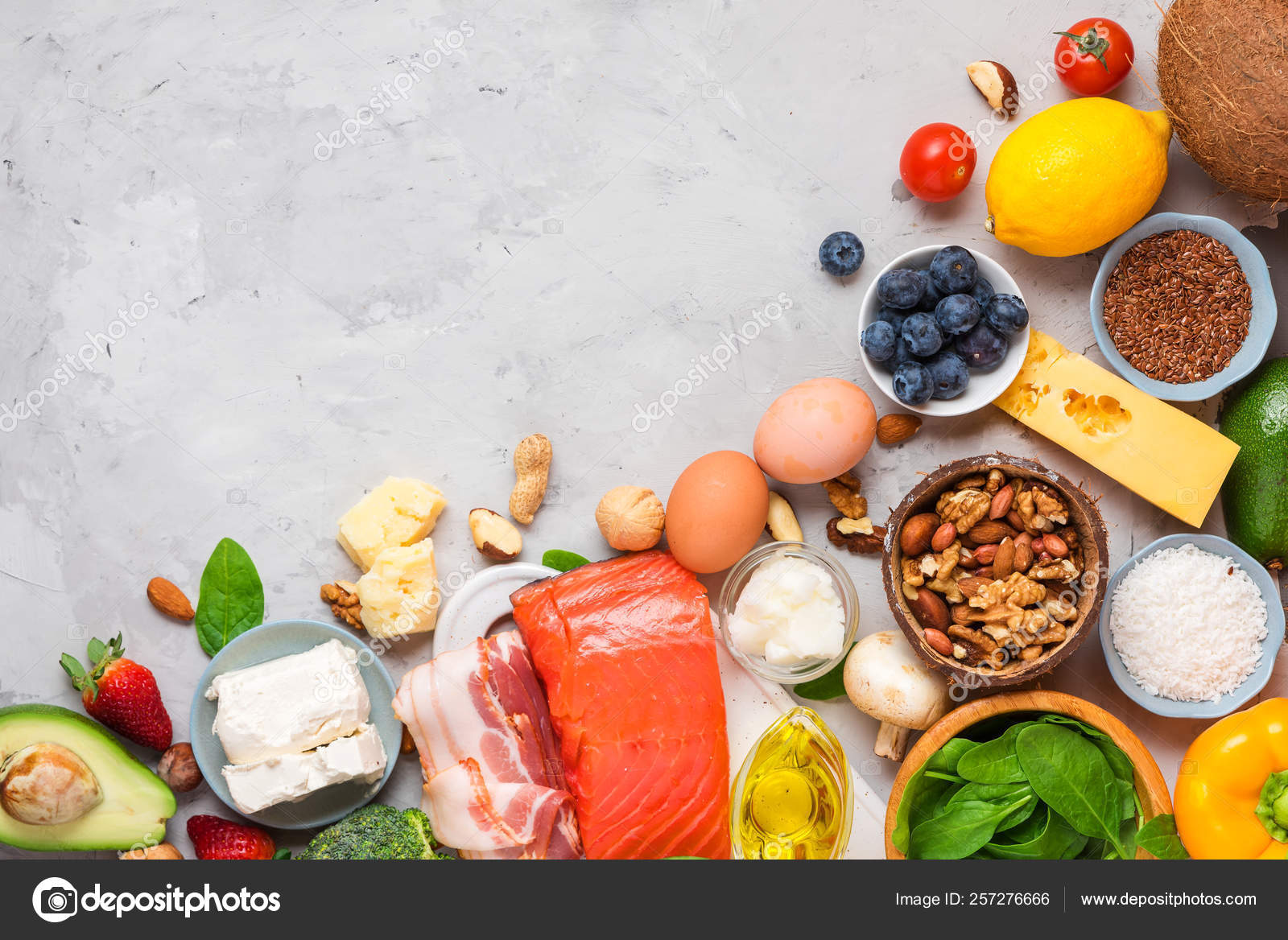 Keto diet concept. Ketogenic diet food. Balanced low-carb food background.  Vegetables, fish, meat, cheese, nuts Stock Photo by ©  257276666
