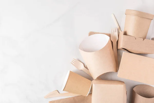 Eco-friendly disposable tableware made of bamboo wood and paper on white marble background — Stock Photo, Image