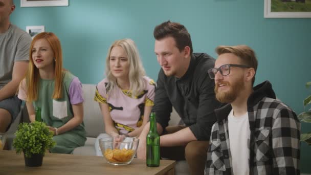 A group of friends is watching a funny but nasty video that disgusts them — Stock Video