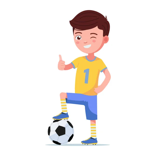 Çocuk futbolcu bir topa ayakla ayakta