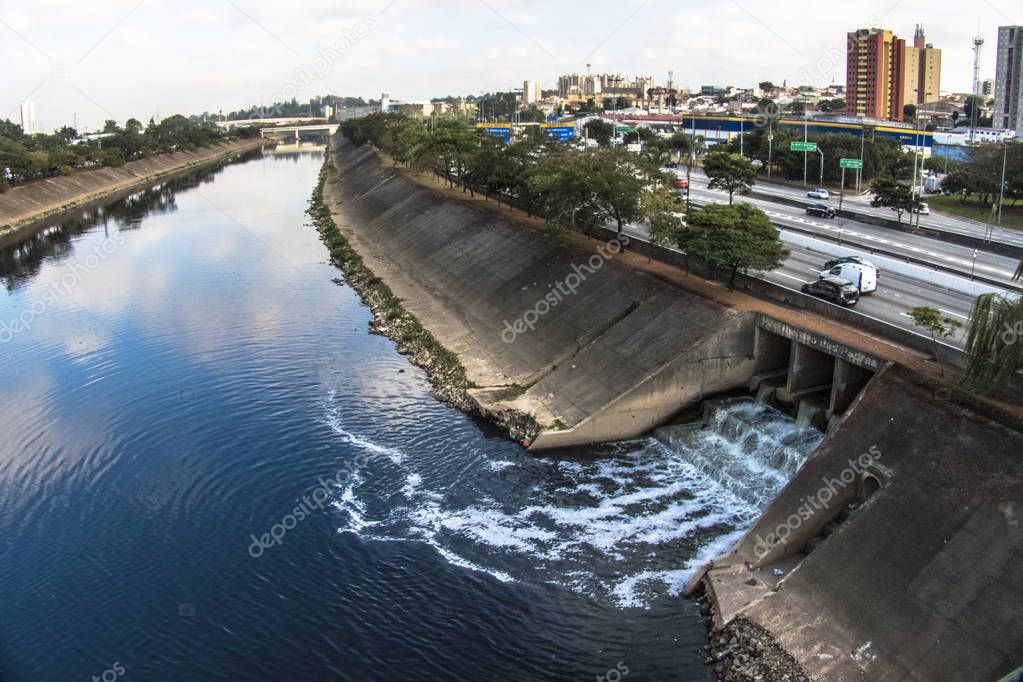 Retaining wall of the Tiete river and the polluted stream of Pedras river river in West zone of Sao Paulo city