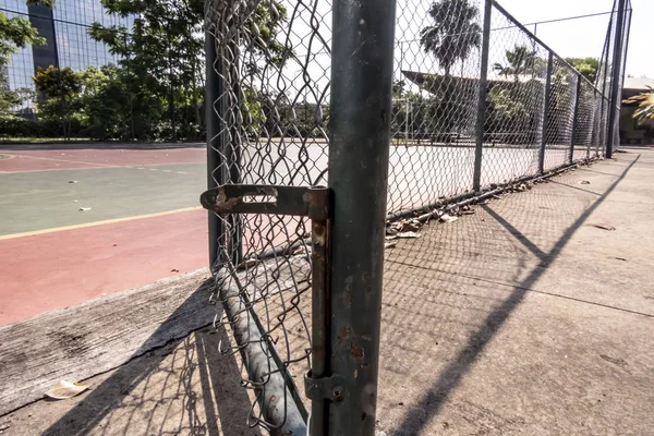 Iron gate with railing at the entrance of the multi-sport court on park in Brazil