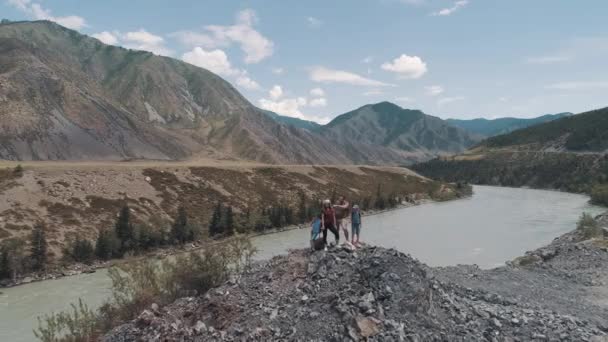 Aerial. family in the journey. parents with children went Hiking in the mountains. parents and children in the campaign — Stock Video
