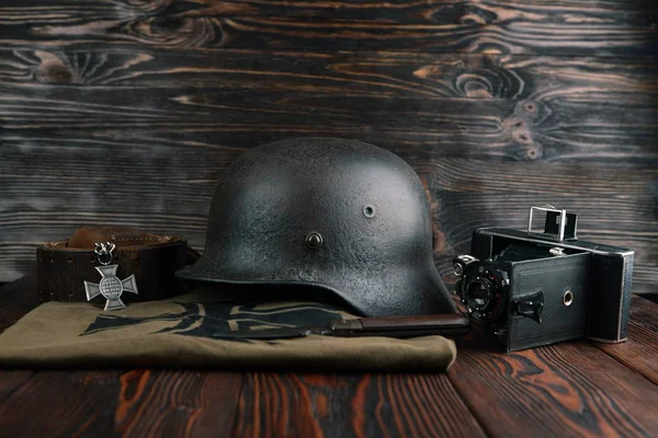 Rusty german army helmet from second world war. The inscription on a medal in the German language - for faithful services in the police.
